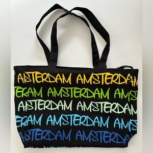 Lg blk canvas tote, multi color "Amsterdam." Int zip pocket, zip closure. $25.